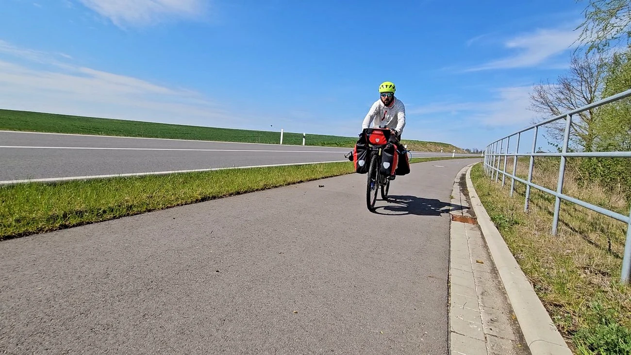 Loaded touring bicycle on an open road